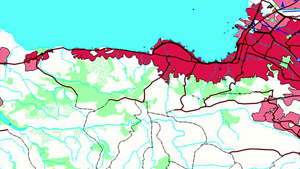 A simple coastal map with regions shaded red and green on a white background and roads shown in red