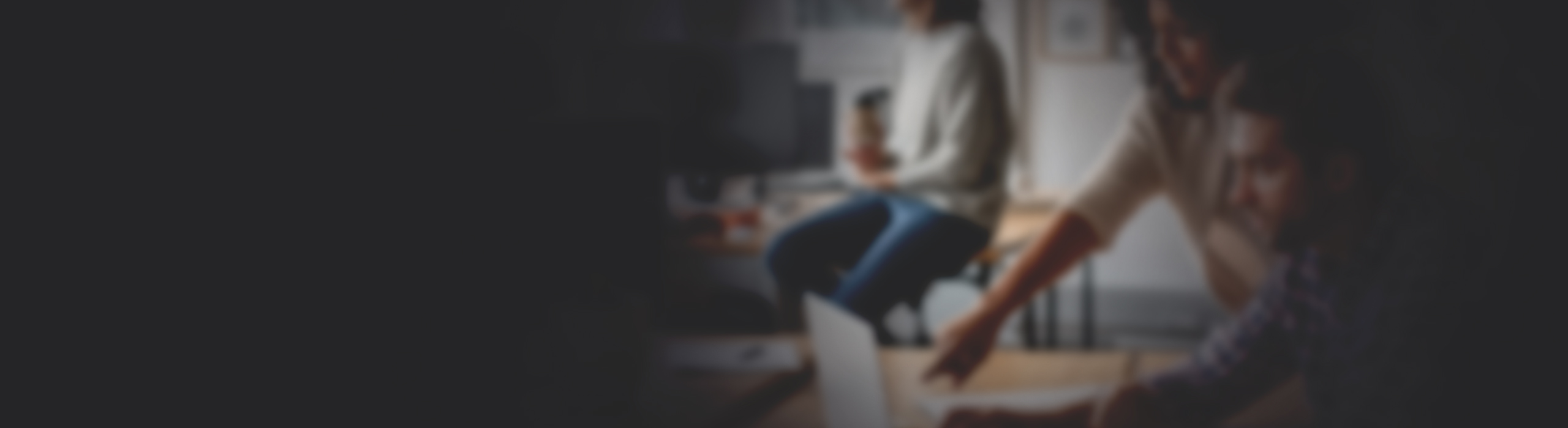 Two people in an office looking at a computer screen