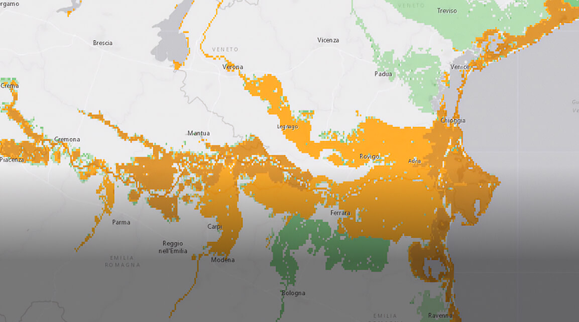 A map of color-coded flood risk, with green shades representing low risk and shades of orange, high risk