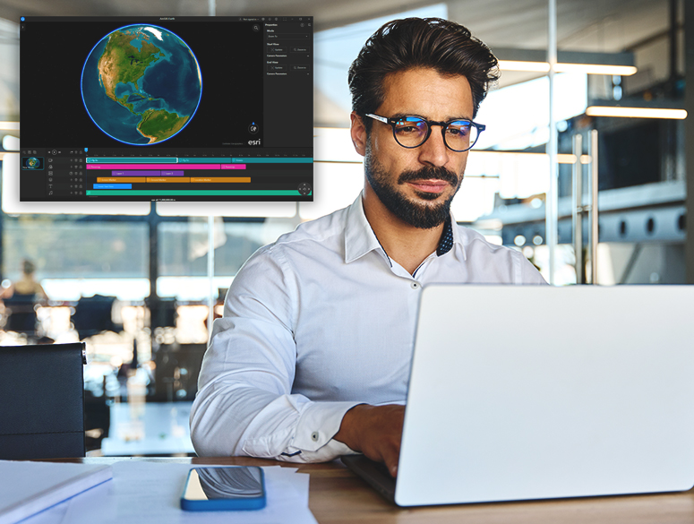 A person wearing glasses and using a laptop in a well-lit office overlaid with an image of the ArcGIS Earth interface
