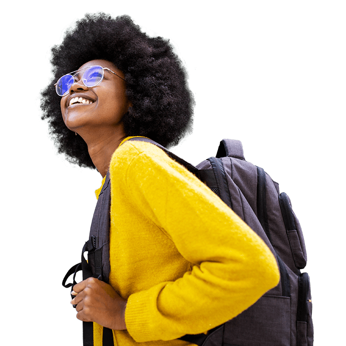 Person smiling while attending the Esri User Conference, wearing a yellow shirt and backpack