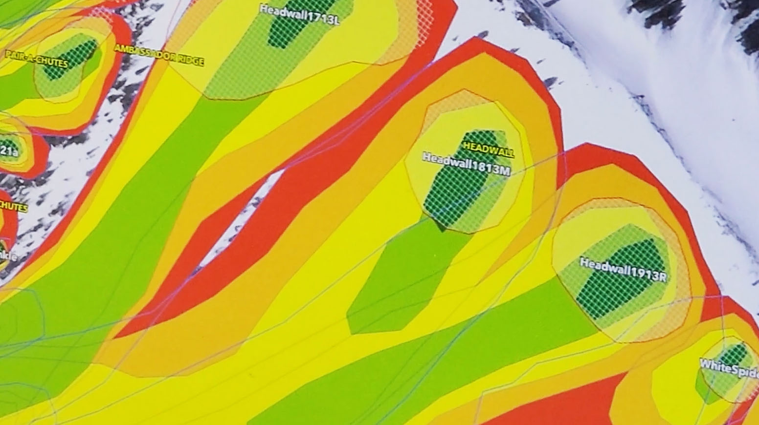 Color-coded map showing modeled avalanche risk zones across mountainous terrain with labeled headwalls and intensity gradients