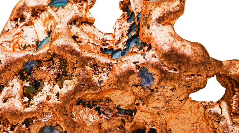 Close-up of raw copper ore with a textured metallic surface