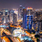 Tel Aviv at night with busy highways, tall buildings, and skyscrapers