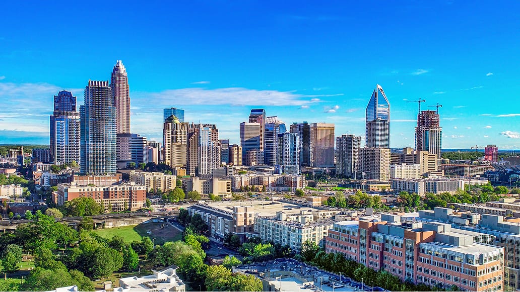 A city skyline with many skyscrapers under a clear blue sky