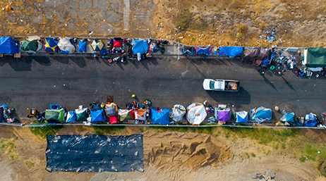 An aerial view of encampments lining a street