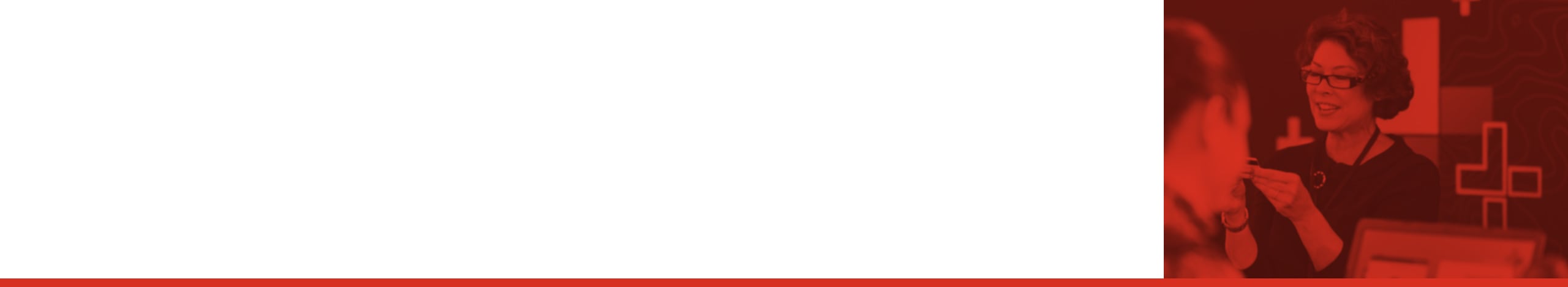 Red-tinted photo of a person working in a transit operations center