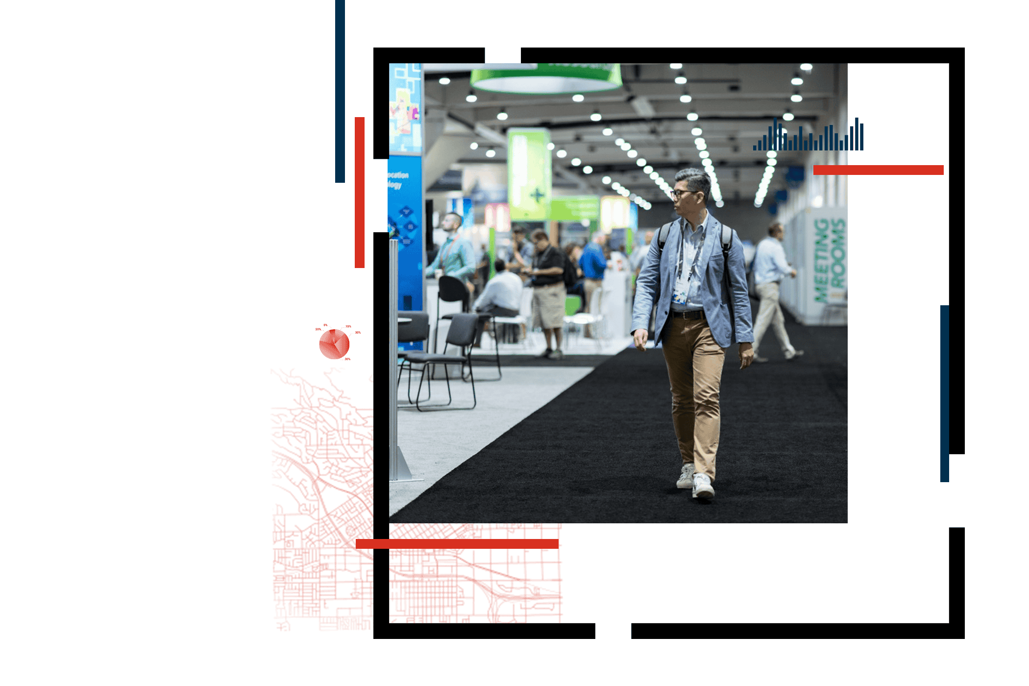 Conference attendee in a casual jacket and chinos walks along the edge of an exhibit hall