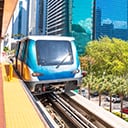 An open-air commuter rail station in the heart of a city