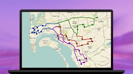 A graphic of a computer monitor displaying a multicolored route map on a purple background