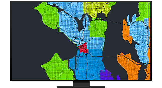 A graphic of a computer monitor displaying a city map with separate areas colored different shades of blue, green, and orange