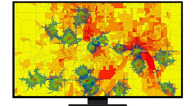 A graphic of a computer monitor displaying areas on a map colored in blue and red on a yellow background