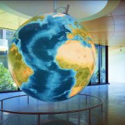 Floor-to-ceiling globe in an office building