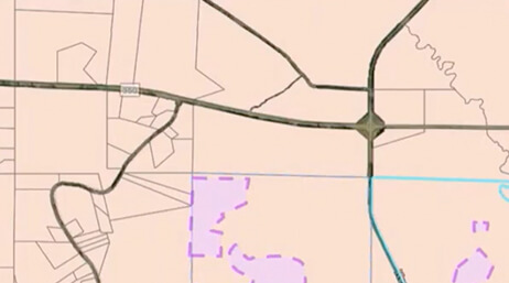 A screencap from the featured video showing a street map with routes shown in green and black on a light pink background