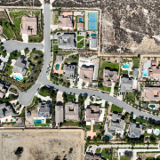Aerial view of a subdivision with homes and pools
