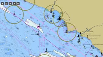 : A nautical chart showing a body of water and a coast with various markings in pink and dark green