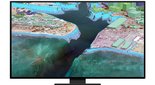 A monitor displaying a colorful 3D map of elevated land