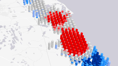 A concentration map in white and gray with map points shown as columns of gray, blue, and red