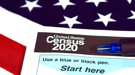 A Census form lying on a red, white, and blue US flag