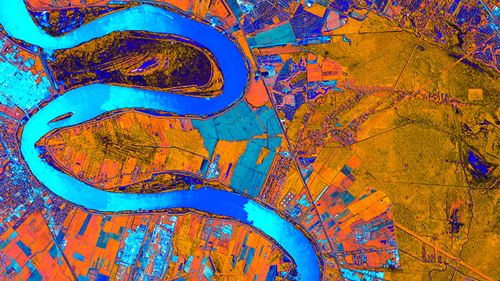 A heat map in orange and blue with a blue river winding through the center