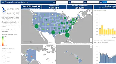 A screencap from the featured video with a map dashboard of the USA in blue and white alongside several graphs and data points