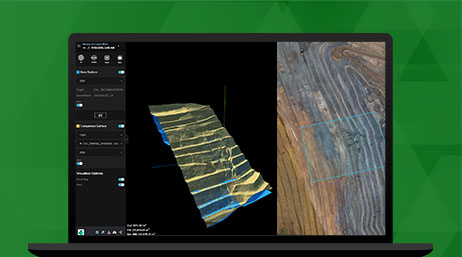 A laptop displaying Site Scan for ArcGIS with a digital reconstruction of a mining landscape used for visualization and reconstruction