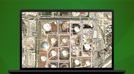 A graphic of a laptop monitor displaying an aerial photo of an oil refinery in light and dark brown
