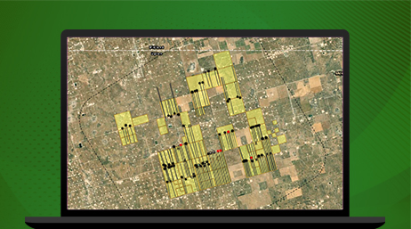 A city map in green and brown overlaid with a black grid of squares