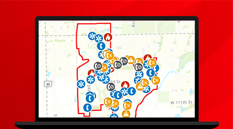 A graphic of a laptop monitor displaying an emergency incident map scattered with alert points