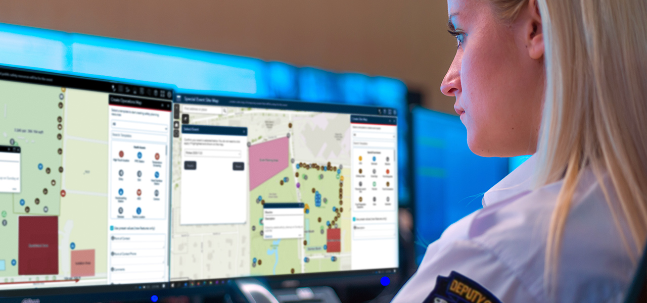 Person looking at two computer monitors with a special event operations map and special event site map