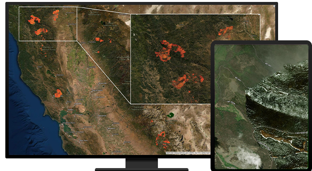 Desktop and tablet showing satellite imagery of a fire