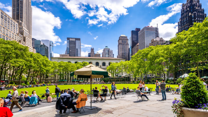 People sitting at tables in Central Park