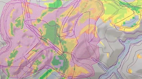 A zoomed in map in grey, yellow, green, and pink 