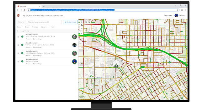 A desktop with a webpage of asset inventory and a map showing easy and congested roadway drive times