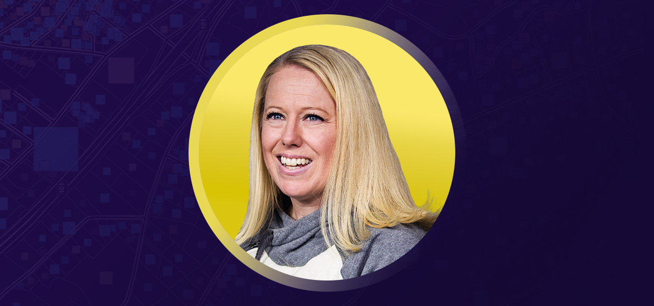 Amanda Opp smiling overlaid on a yellow and purple graphic background 