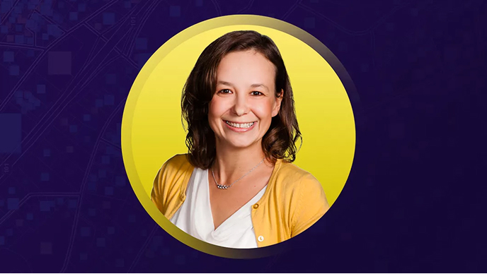 Lumi Matthys smiling and wearing a cardigan overlaid on a yellow and purple background