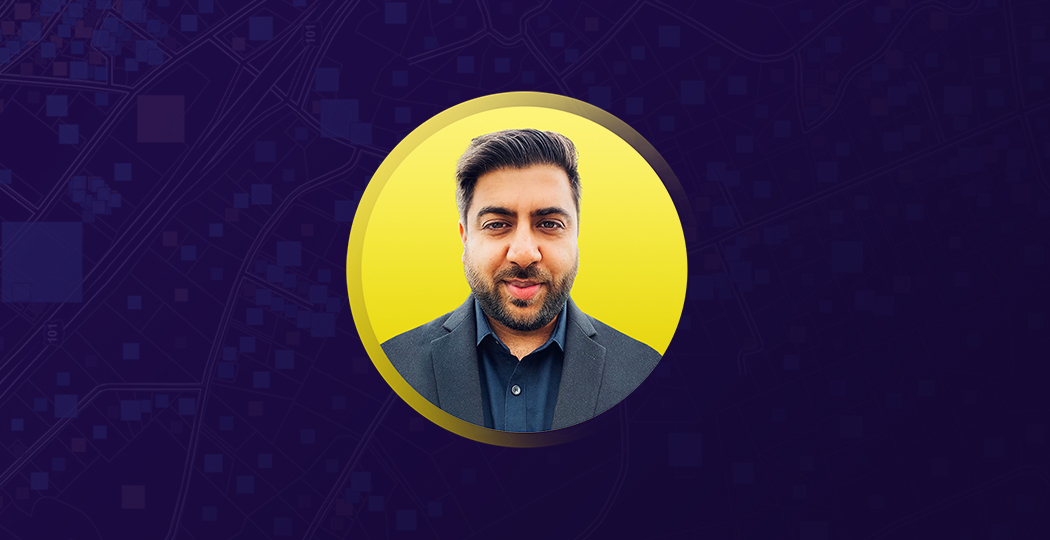 Portrait of Rahul Sawlani smiling in a blue suit and collared shirt