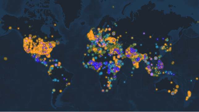 A world map in dark gray and blue with scattered brightly lit multicolored map points