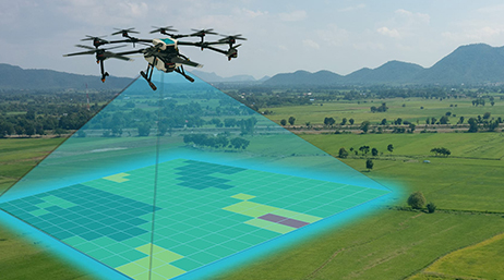Graphic of a large drone scanning a gridded section of a wide green field dotted with trees