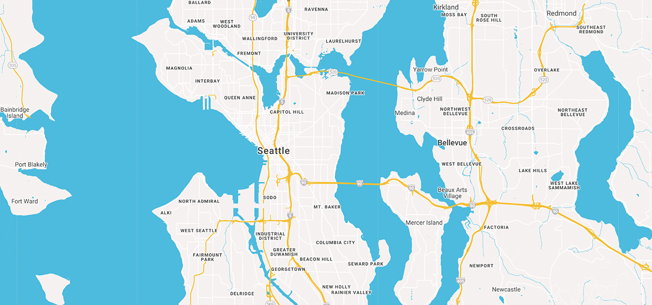 A road map of Seattle in beige and yellow with blue water