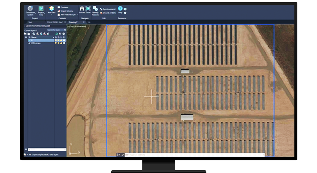 A desktop computer displaying an aerial image of a solar farm