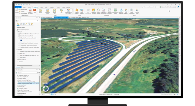 A desktop computer displaying a map in ArcGIS software with added blue lines indicating digital placements of solar panels