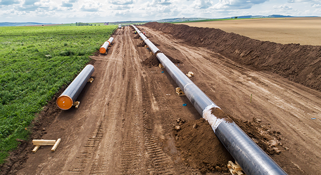 Pipeline construction in recently compacted and prepared dirt 