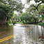 A residential neighborhood with street entirely submerged in flood water