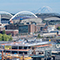 Seattle’s stadium district with football and baseball fields surrounded by buildings and Mount Rainier in the distance
