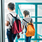 Two children wearing backpacks walking together