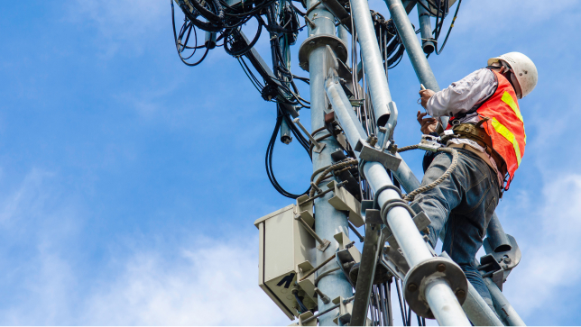 Person climbing a telecom tower