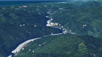 A 3D map of a river running through lush green mountains in Yurok Tribe territory, with house icons noting locations of residences