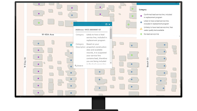 A graphic of a computer monitor displaying a neighborhood map with a point on each home, one of which is projecting a small menu of property data