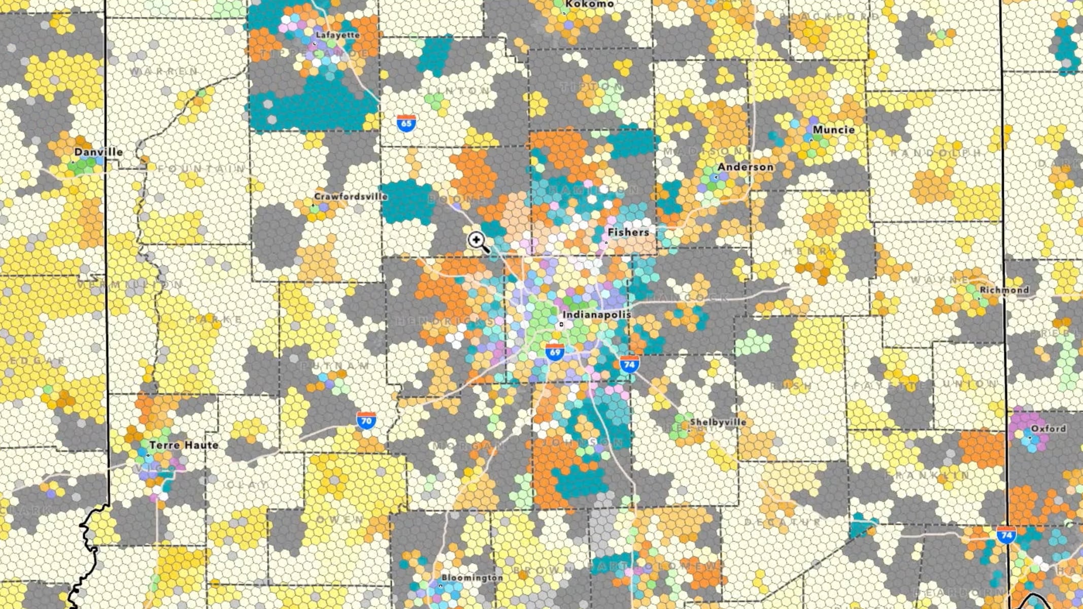 A map with a patchwork of colored data areas and analysis layers across a region